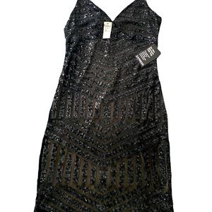 NEW! Beautiful little black dress.